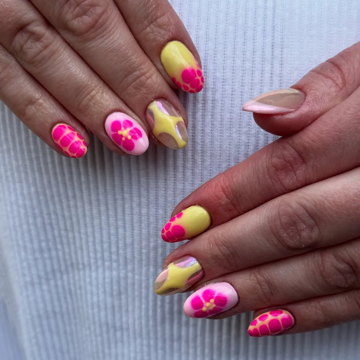 Hot pink flowers on pale yellow with a star-shaped accent