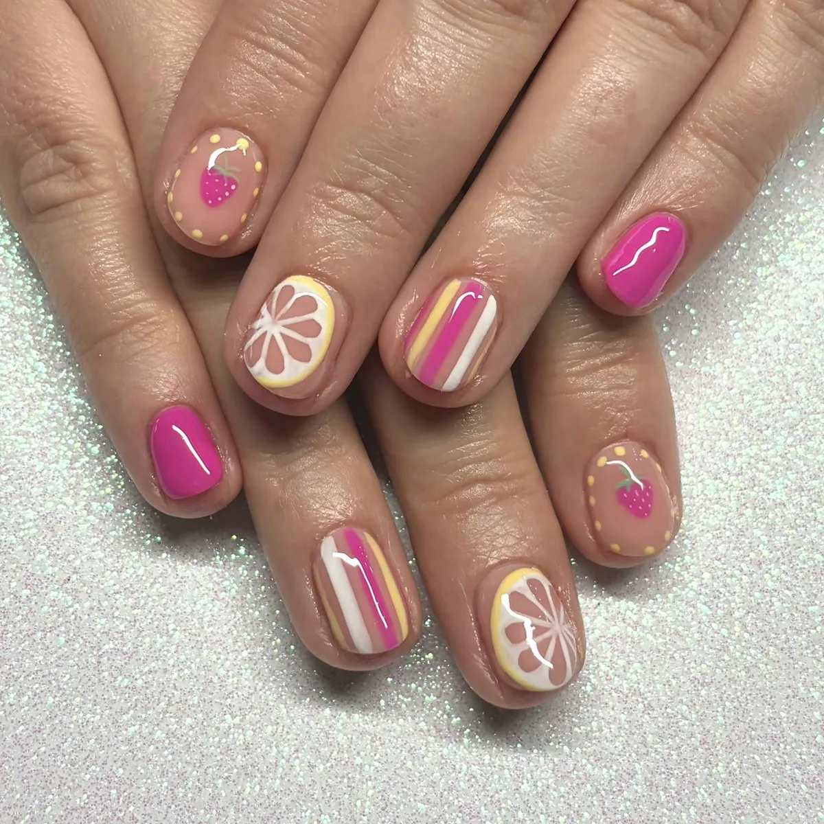 Short pink set with stripes, citrus slice, and strawberry-style accents