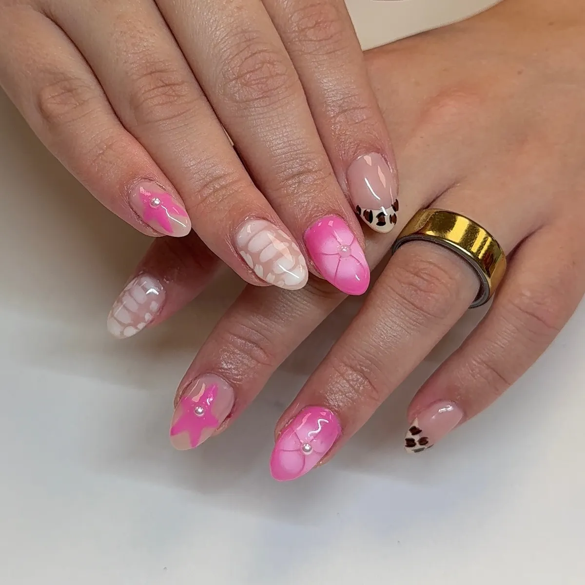 Pink florals with pearl centers and a spotted tip accent