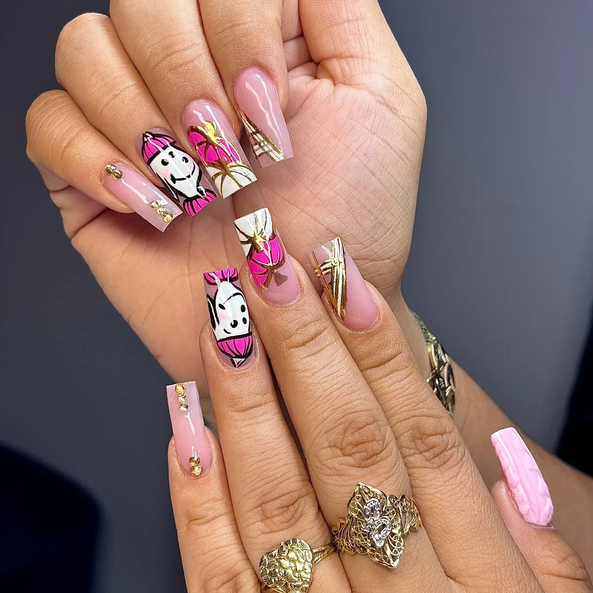 Sheer pink with gold striping, studs, and ghost-face art