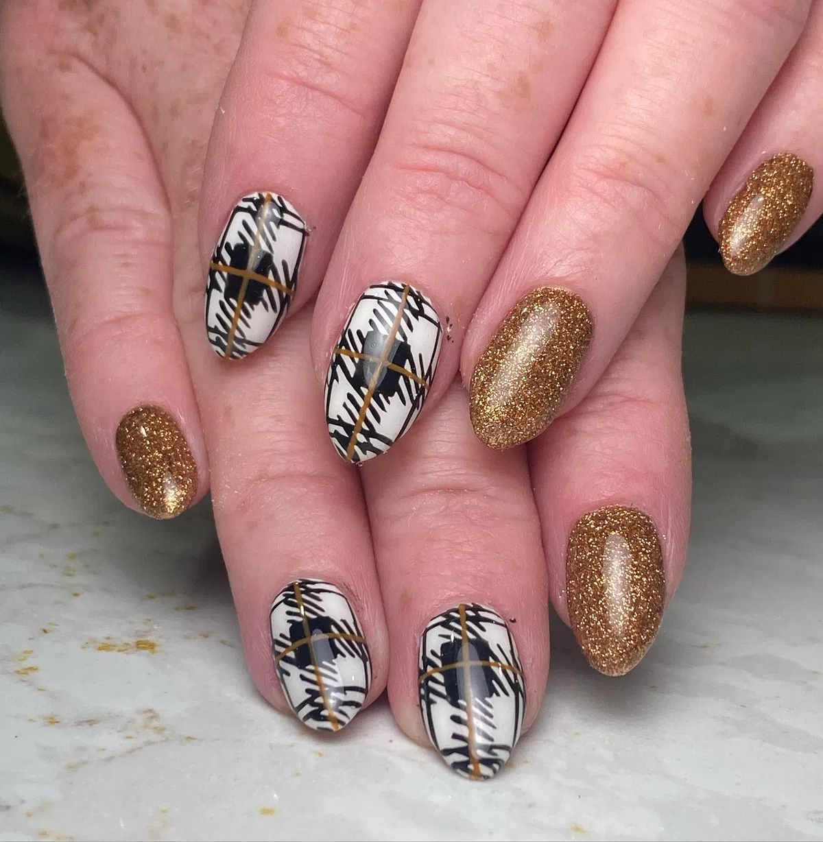 Gold glitter with graphic black-and-white plaid accents