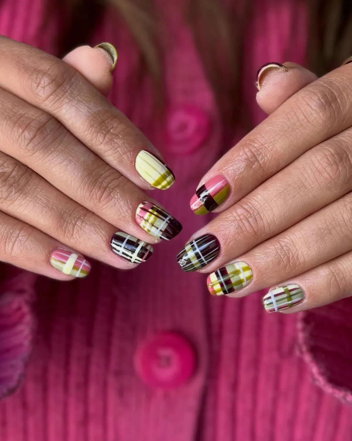 Mixed plaid patterns in olive, pink, and burgundy