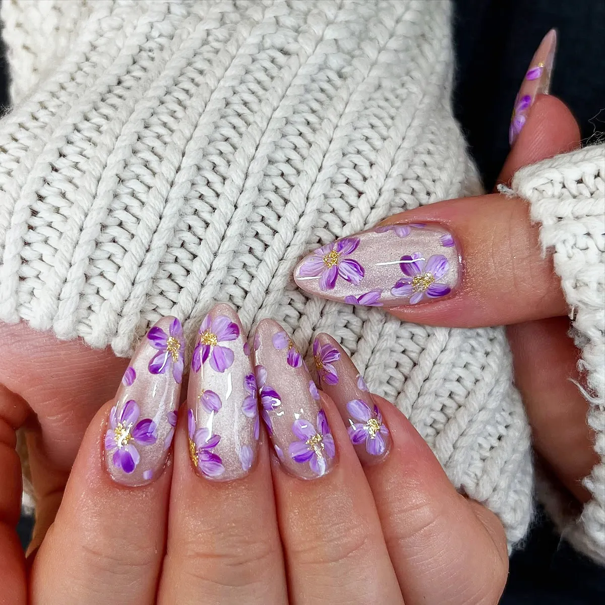 Sheer shimmer base with purple floral art and gold centers