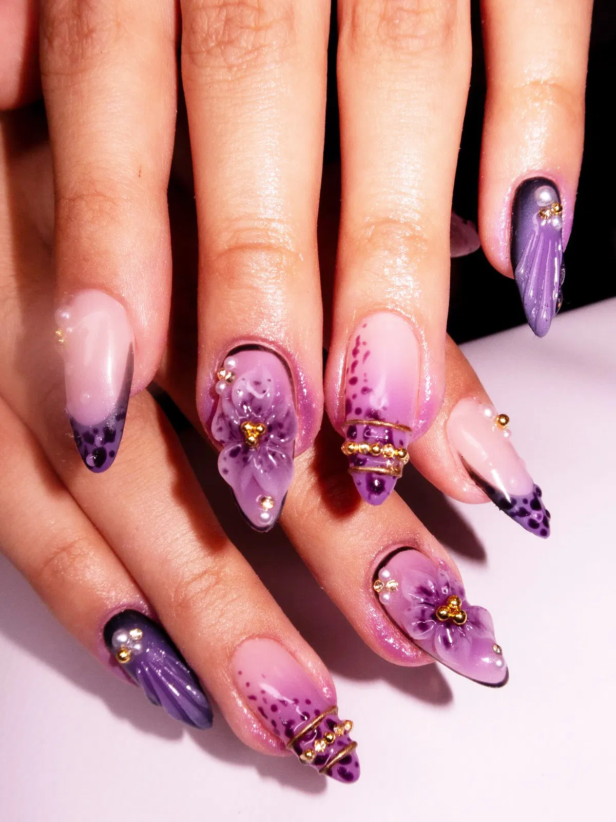 Pink-to-purple gradients with 3D purple flowers and gold bead bands