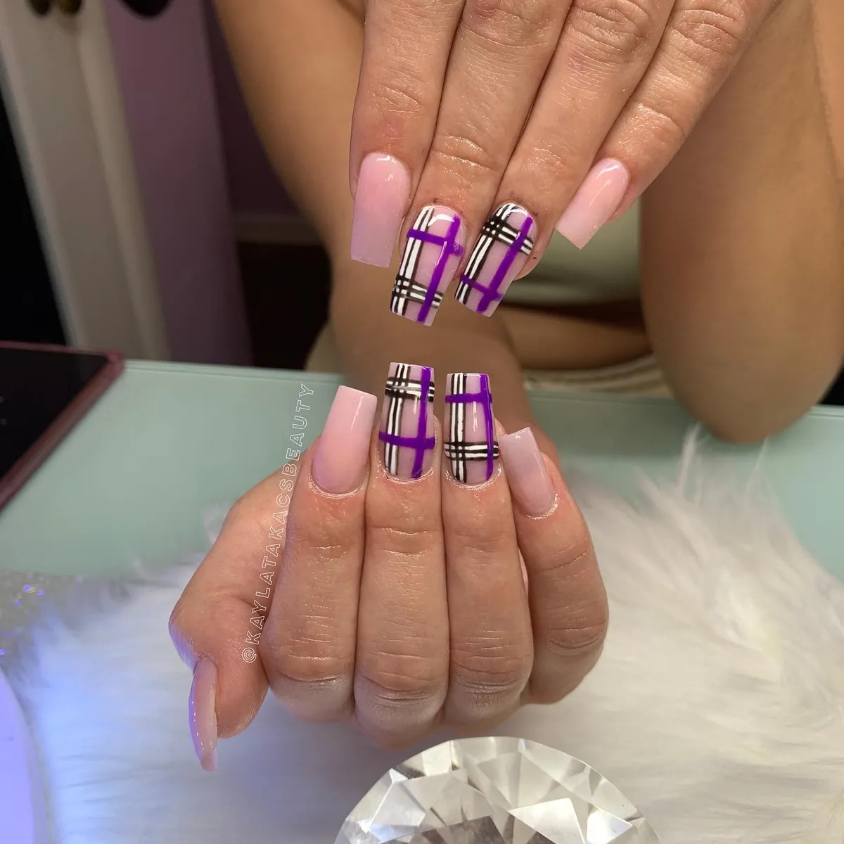 Pale pink set with bold purple plaid accent nails