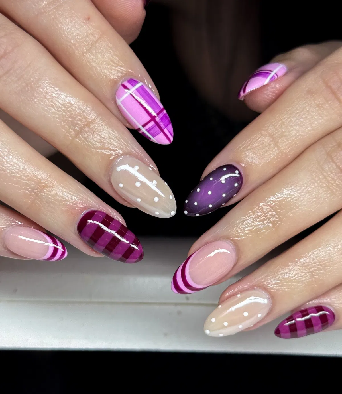Mixed purple plaid, polka dots, and curved stripe accents