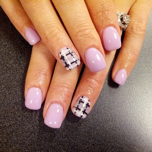 Pale lavender manicure with subtle plaid accents