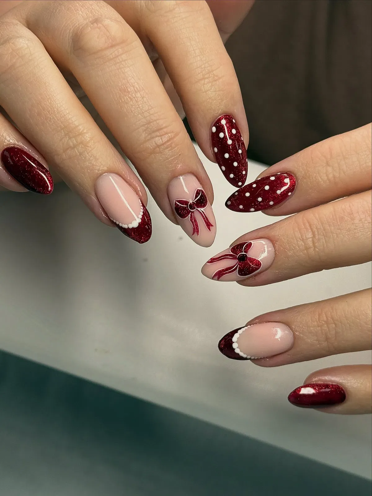 Red glitter polka dots and scalloped French tips with bows