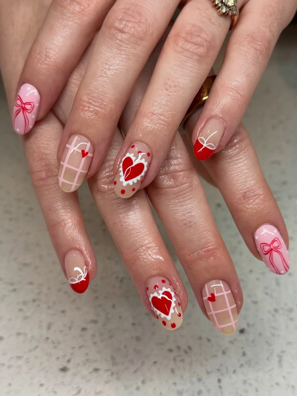 Pink-and-nude mix with red bows, hearts, dots, and grid accents