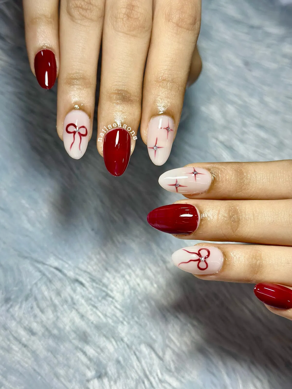Deep red solids with nude bow and starburst accents