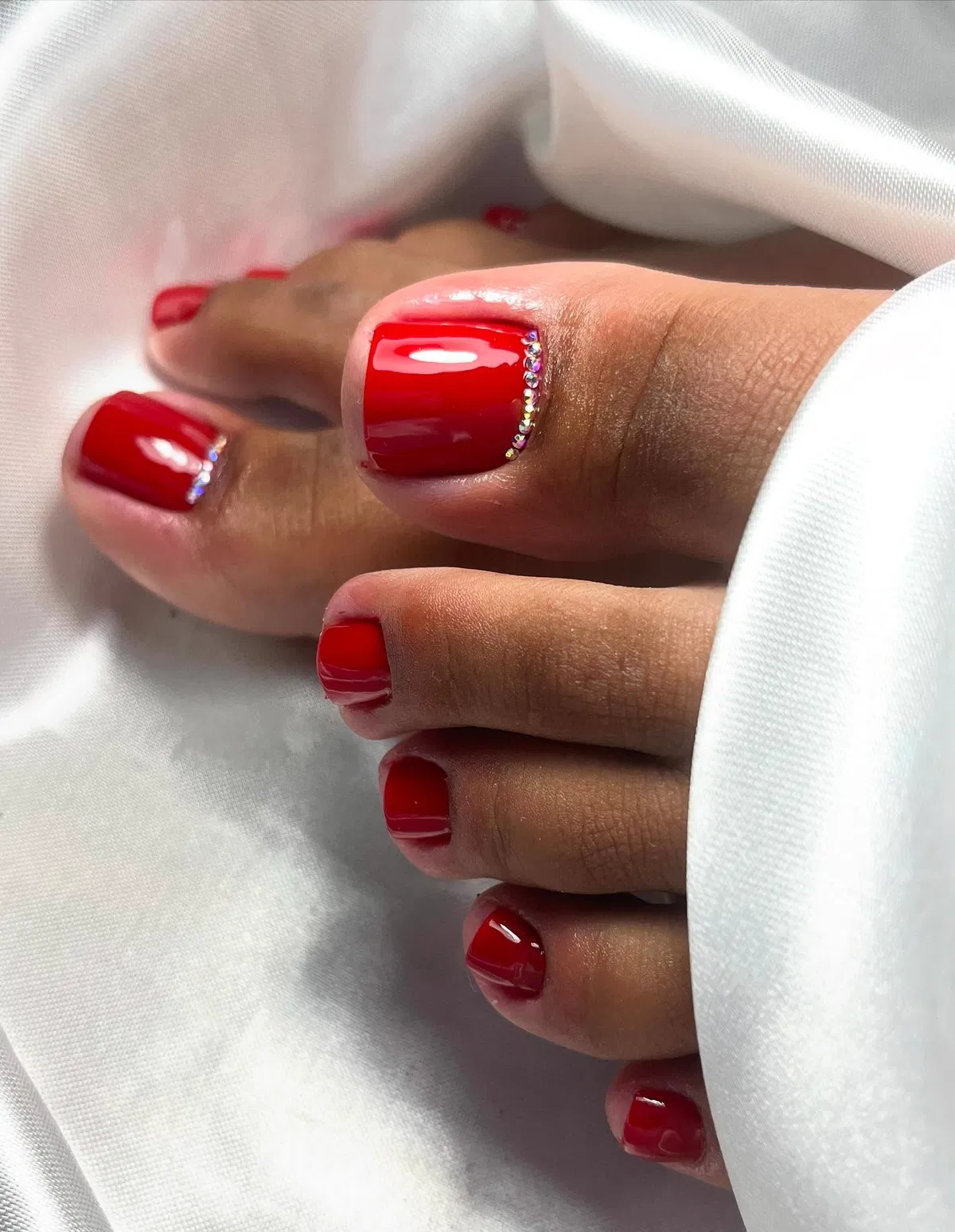 Bright red toes with rhinestone side detail