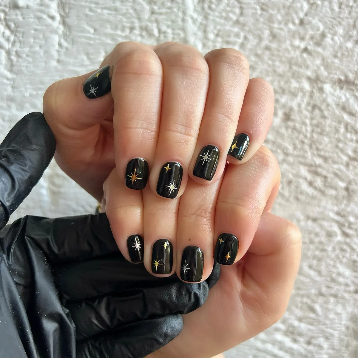 Glossy black with gold and white starbursts