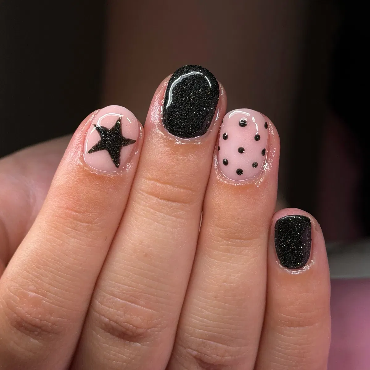 Pale pink accents with black star and dots