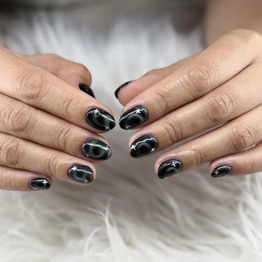 Glossy black with subtle star-like sparkles