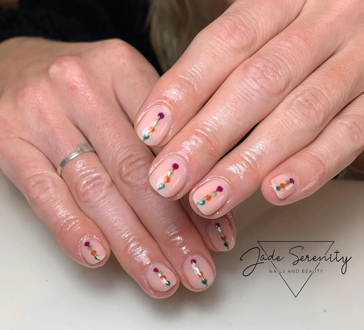 Nude base with tiny multicolor dot-line accents