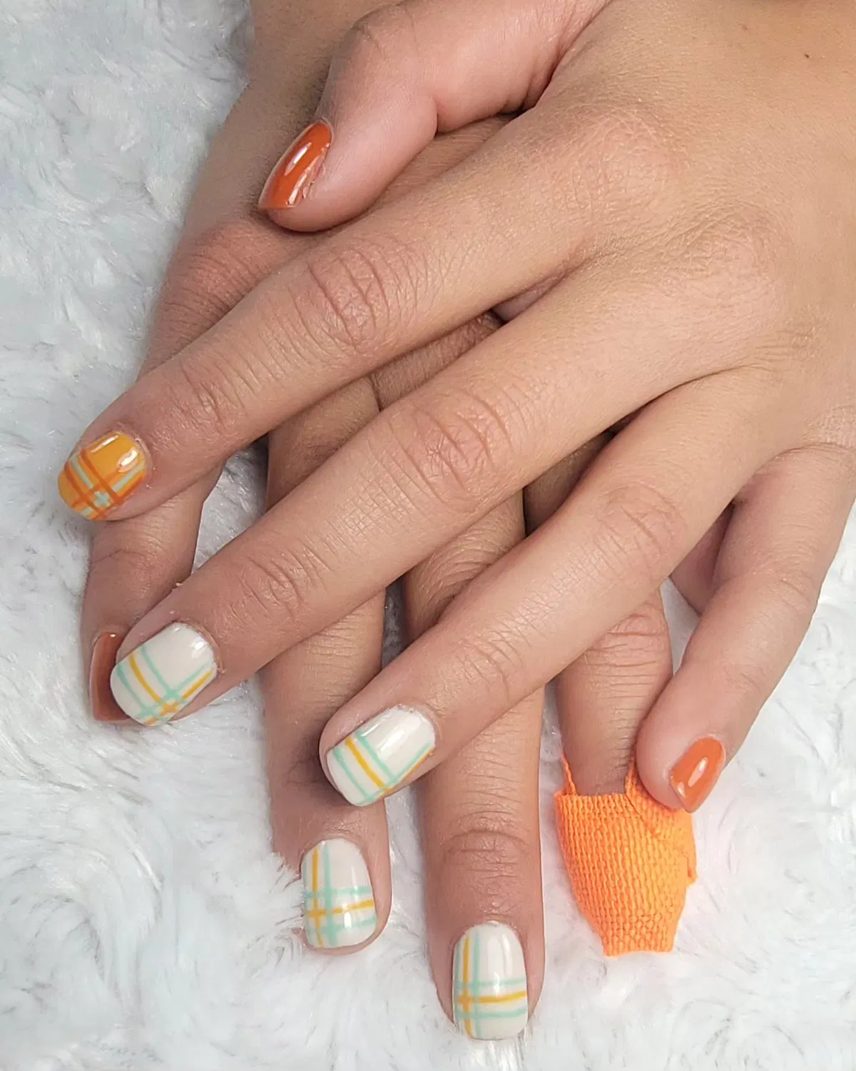 Off-white plaid lines with orange solid nails