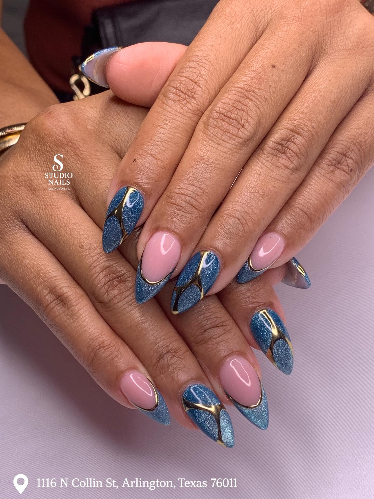 Blue glitter with gold curved bands and nude accents