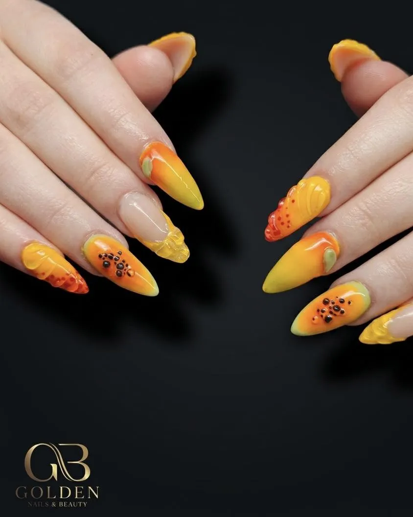 Yellow-orange stiletto set with dot clusters and 3D accents
