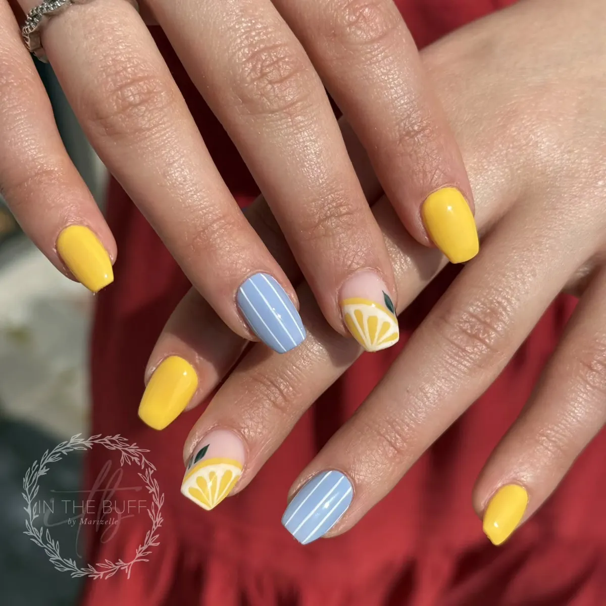 Bright yellow solids paired with blue polka-dot French tips