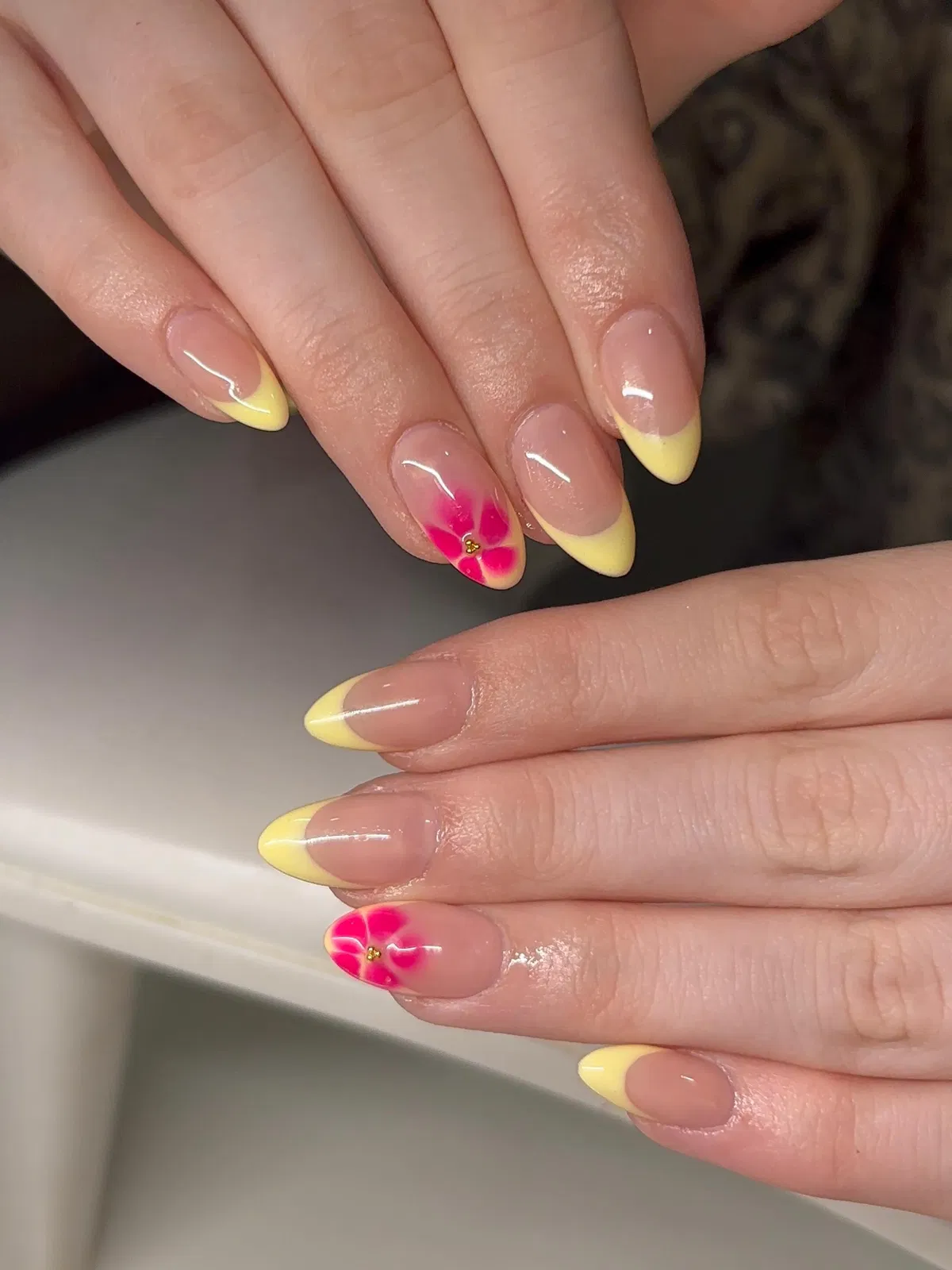 Pastel yellow accents with raised shell textures and gold charms