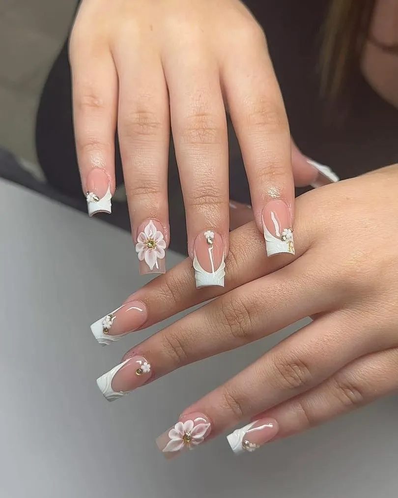 Wave-edge white French tips with rhinestones and raised flowers