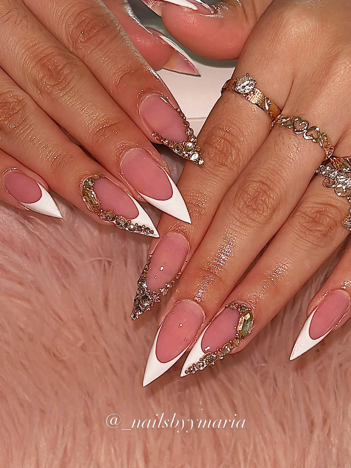 Stiletto V-French tips with gold-toned rhinestone edging