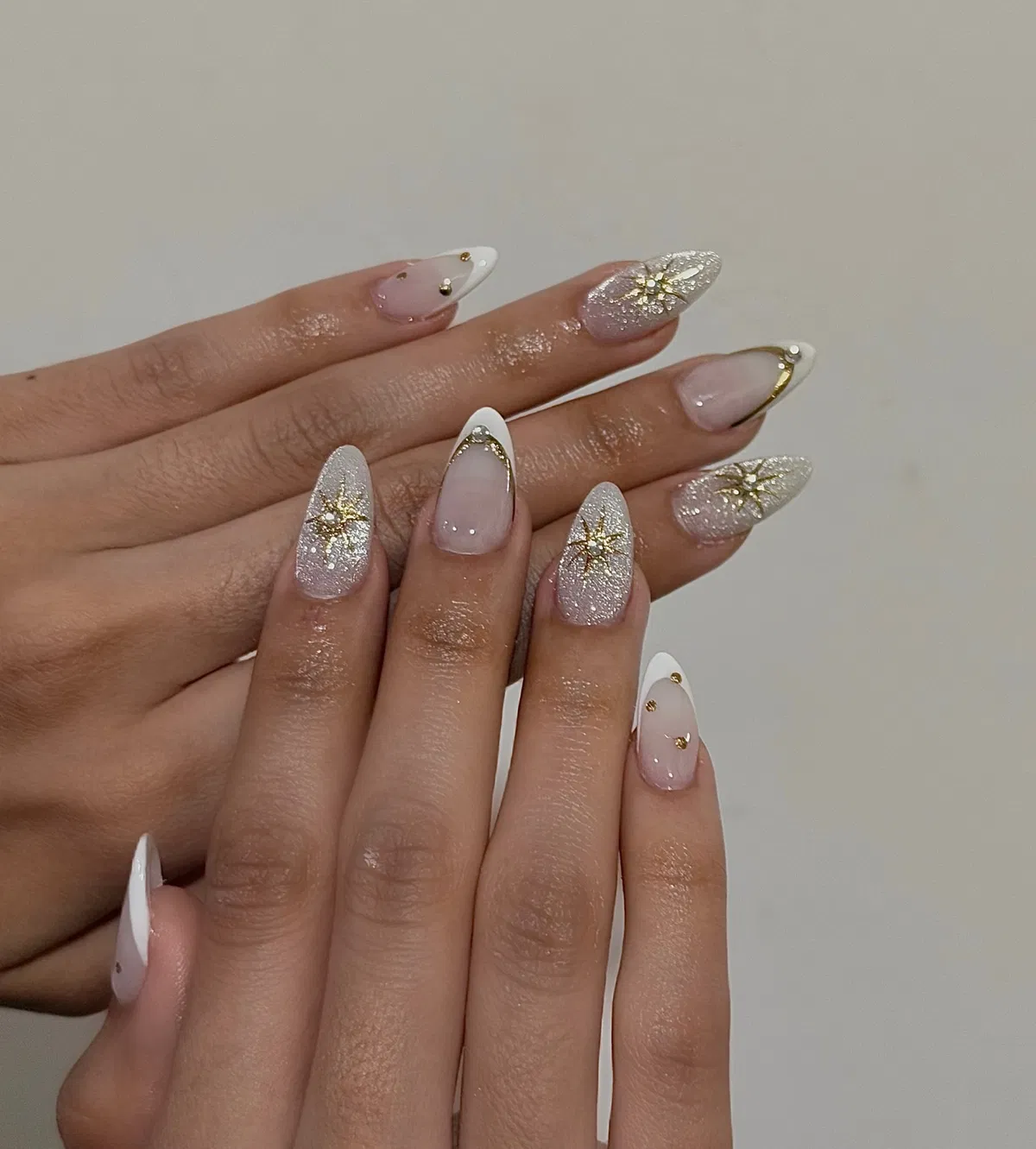 Silver-glitter starbursts with white tips and gold studs