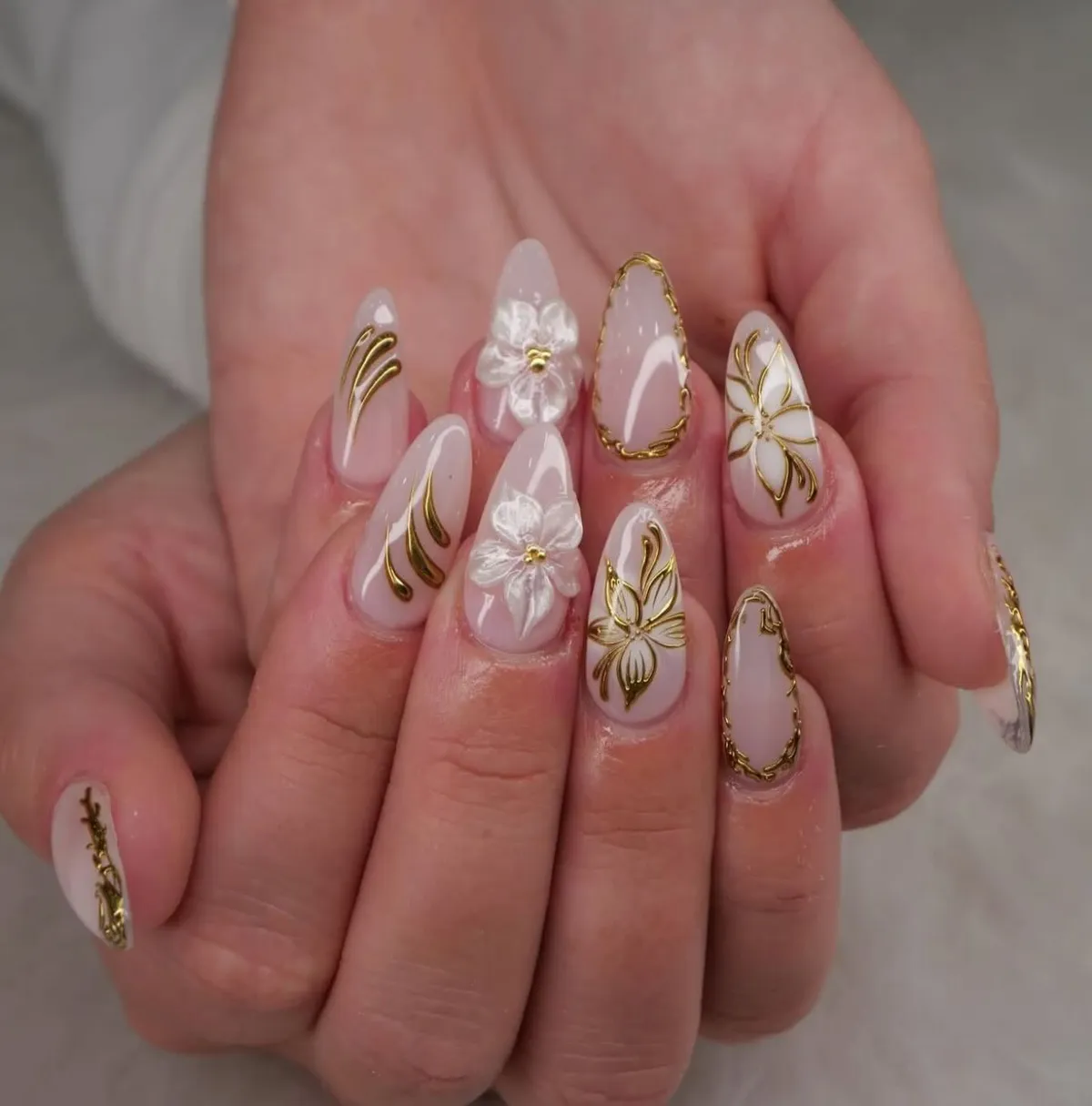 Gold botanical linework with raised white flowers