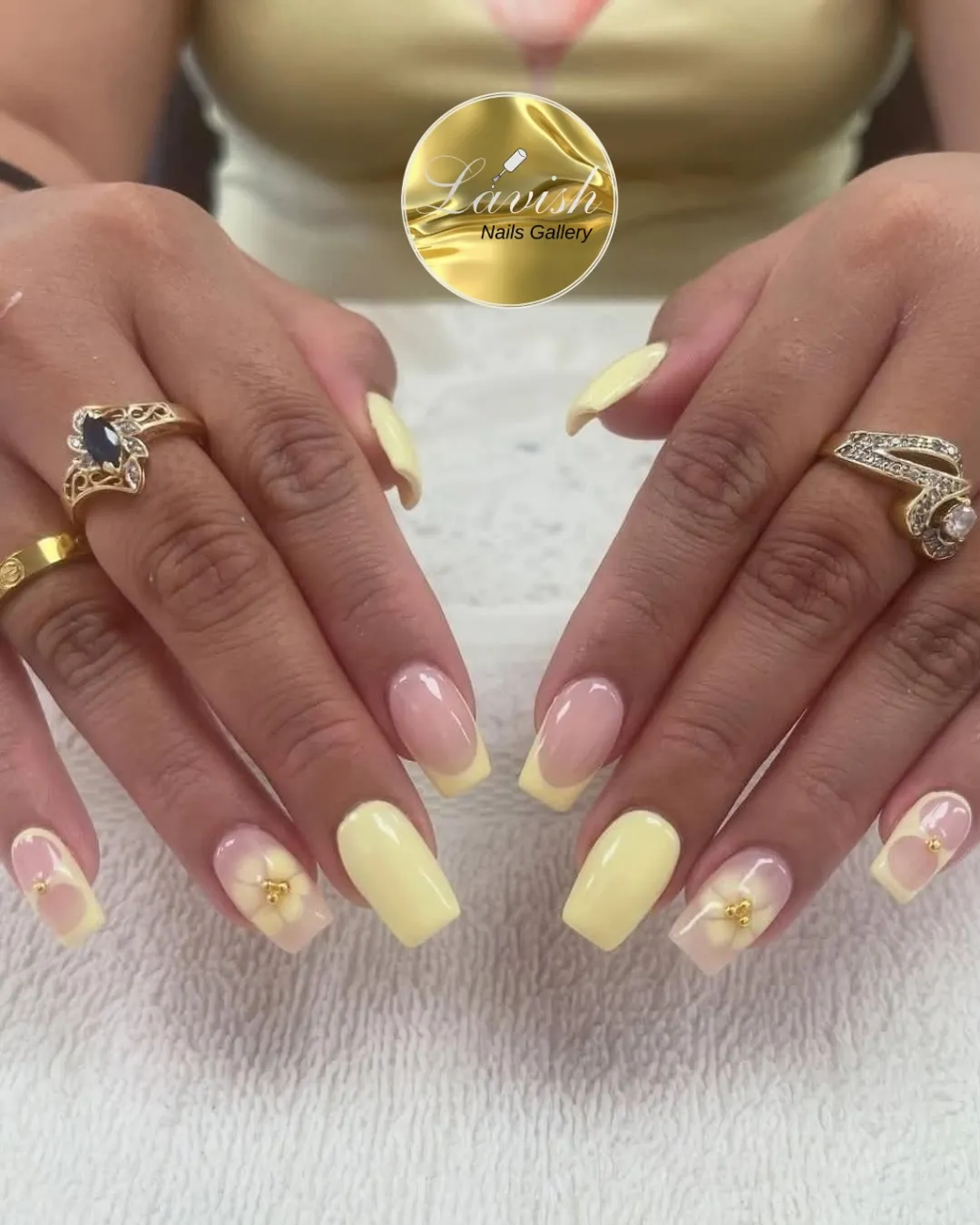 Soft yellow squares with French tips and translucent floral accents