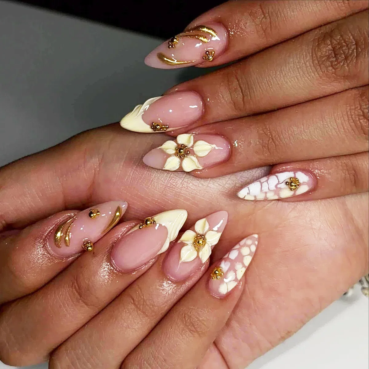 3D cream flowers with gold accents on nude pink