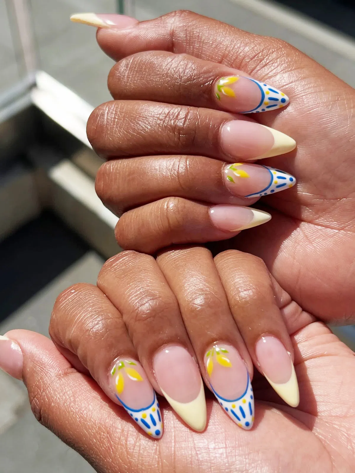 Pale yellow tips with blue-outlined white accents