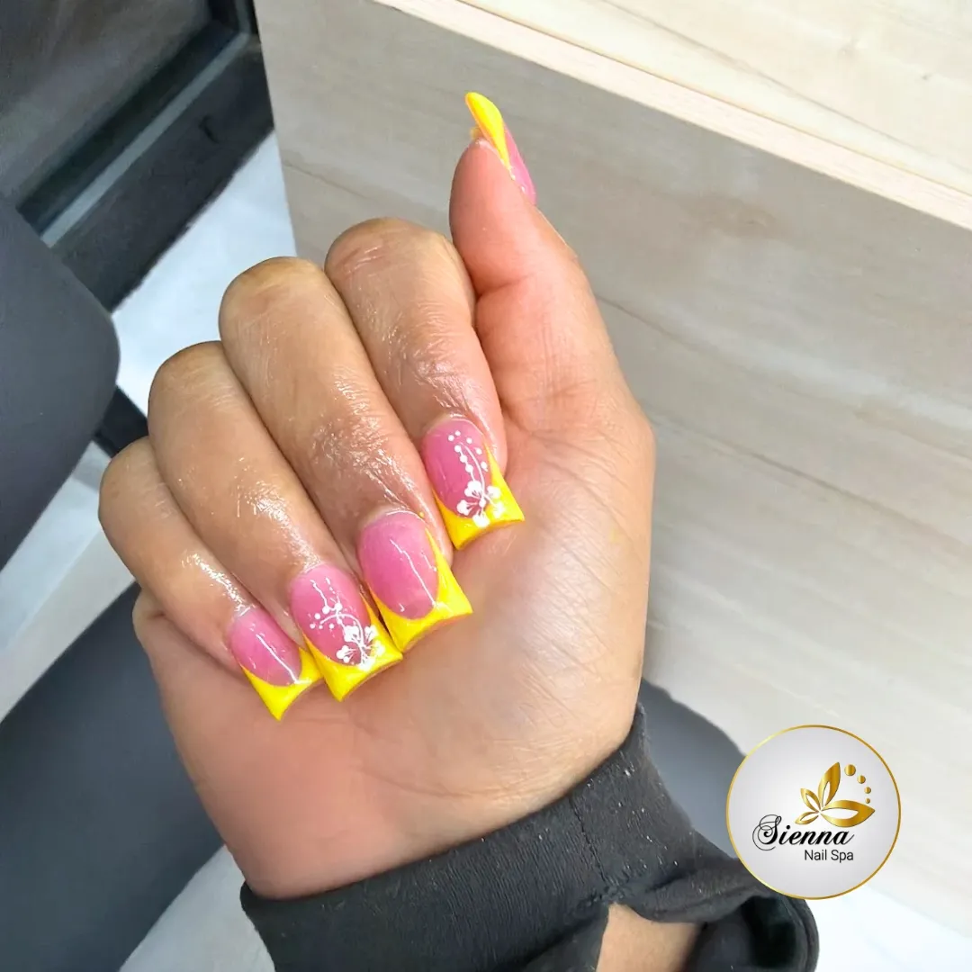 Pink base with bright yellow tips and white floral line art