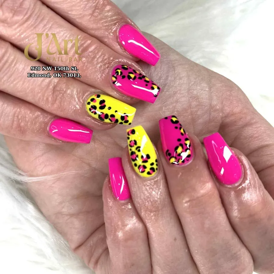 Hot pink solids with yellow spotted accent nails