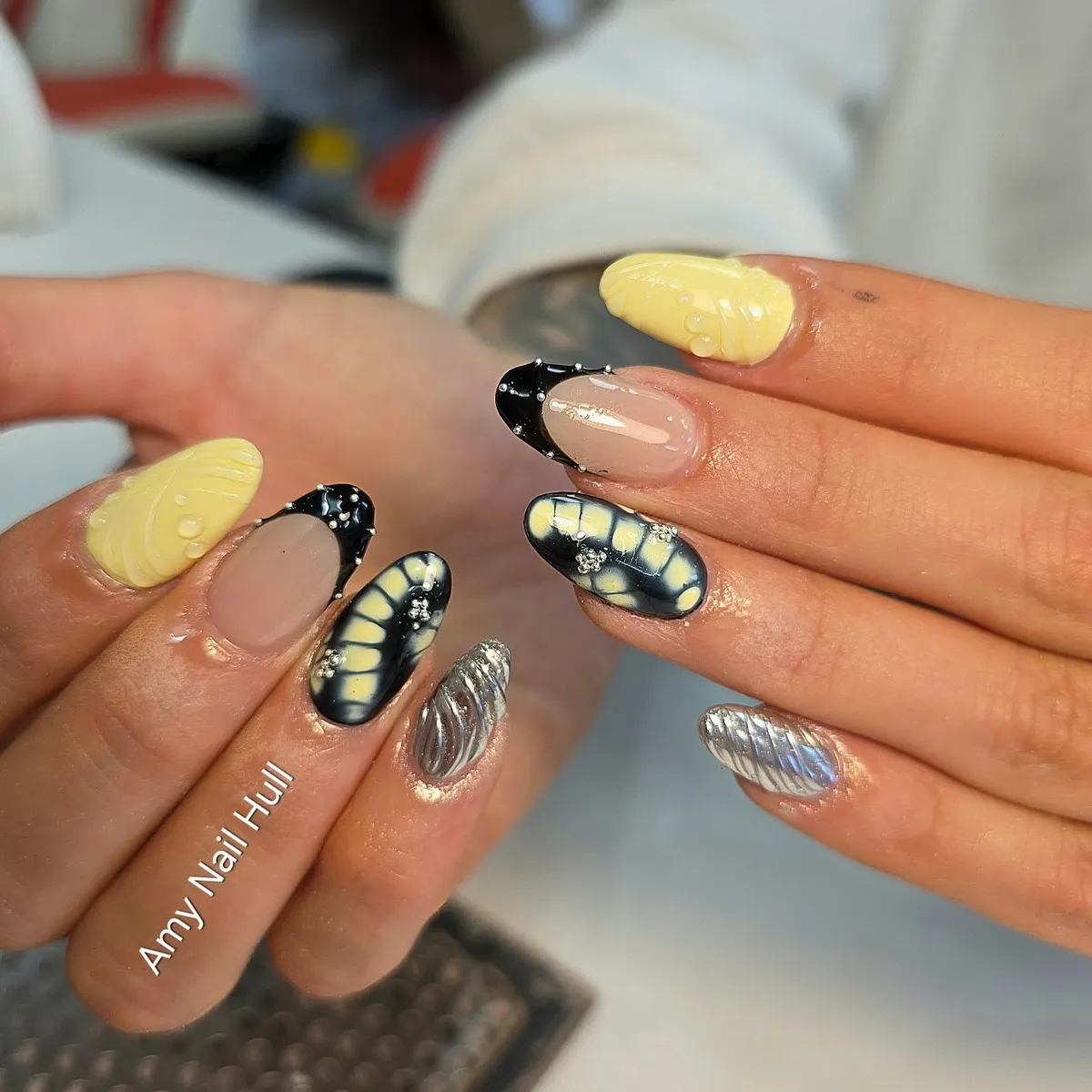 Yellow, black tips, and silver textured accents