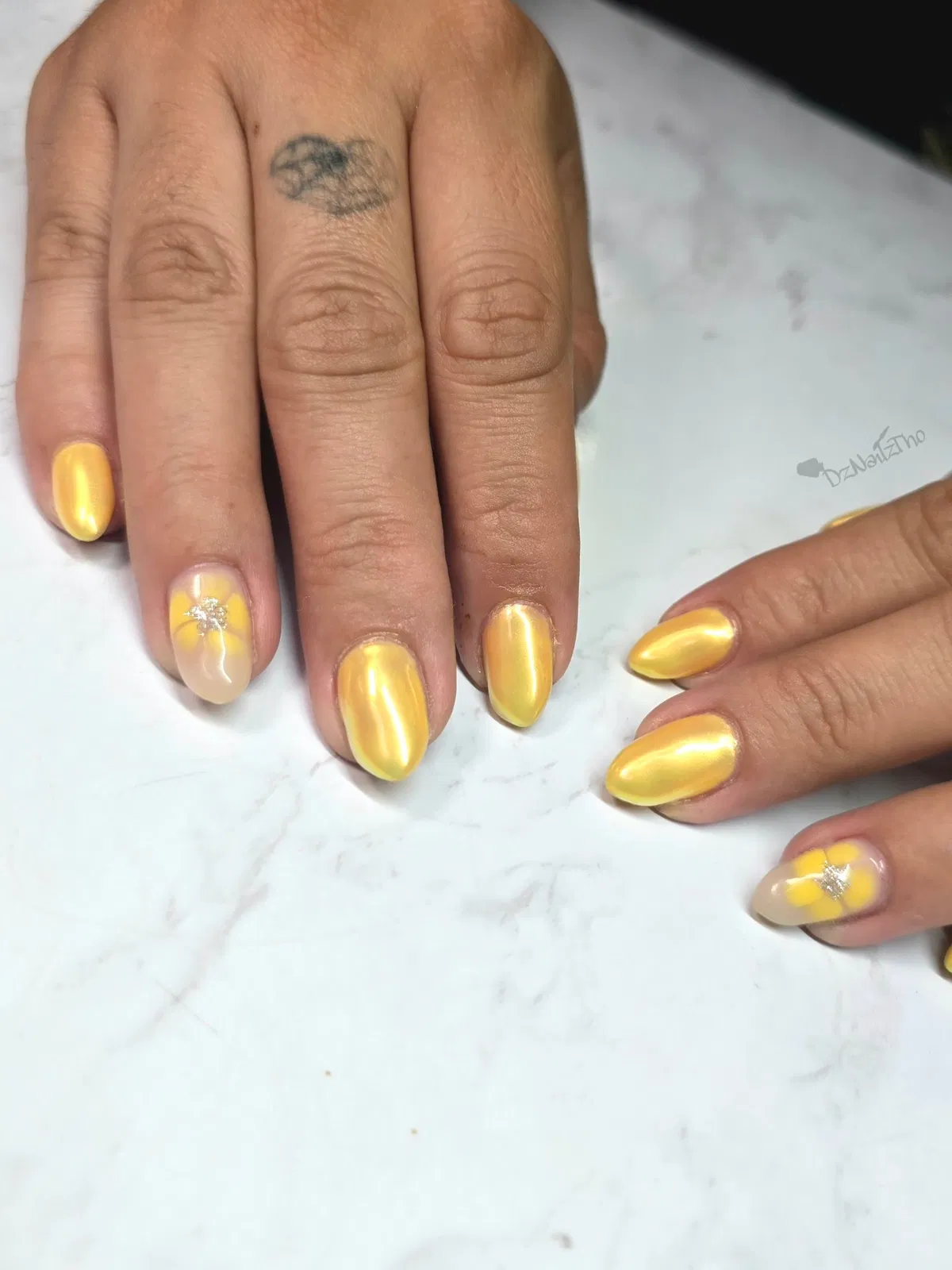 Reflective Yellow Nails with Floral Accent Details
