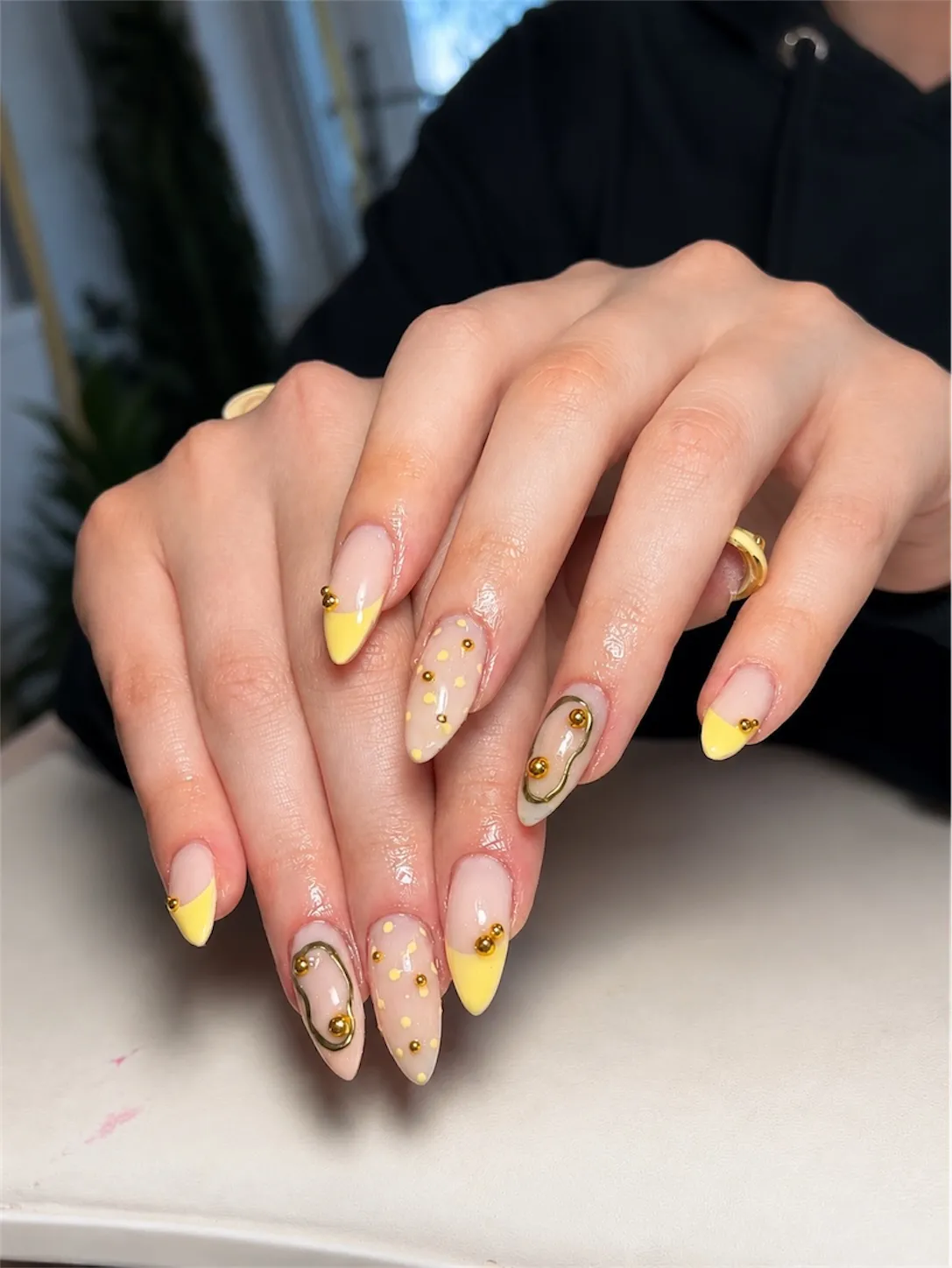 Yellow tips with polka dots and wavy gold outline accents