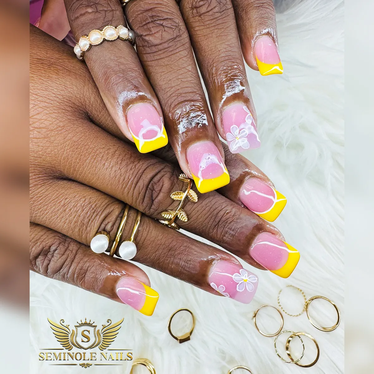 Square yellow French tips with white linework flowers