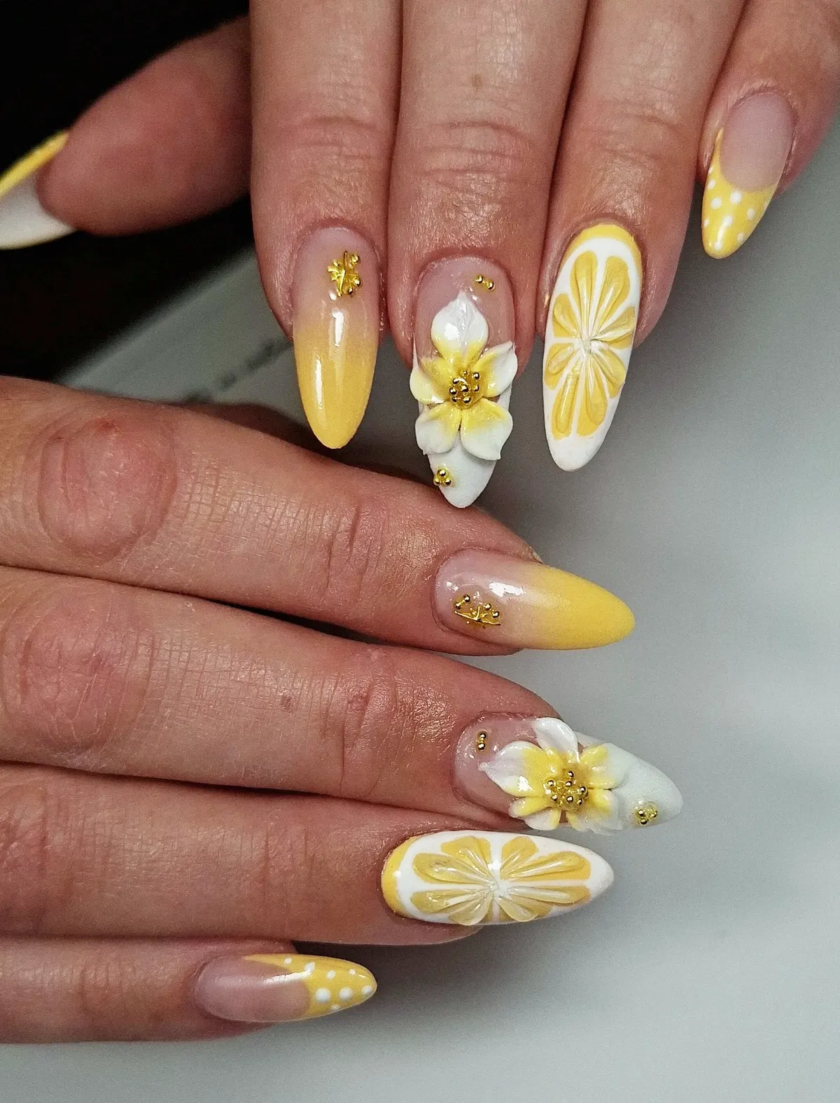 Yellow ombre with citrus slices, 3D flowers, and gold studs