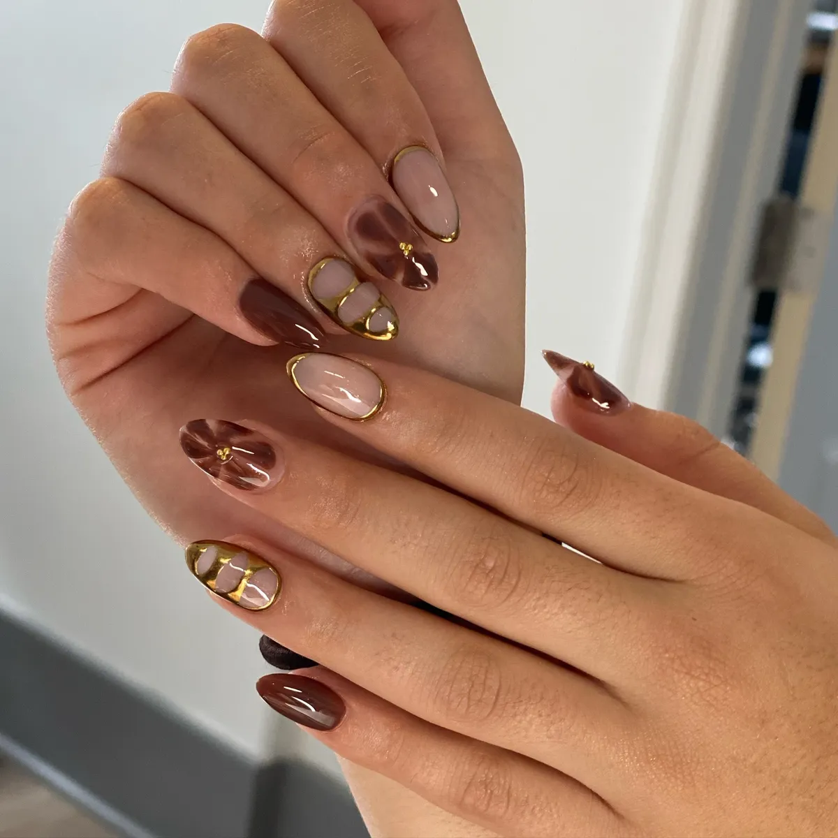 Nude and brown swirls with thin gold outlines
