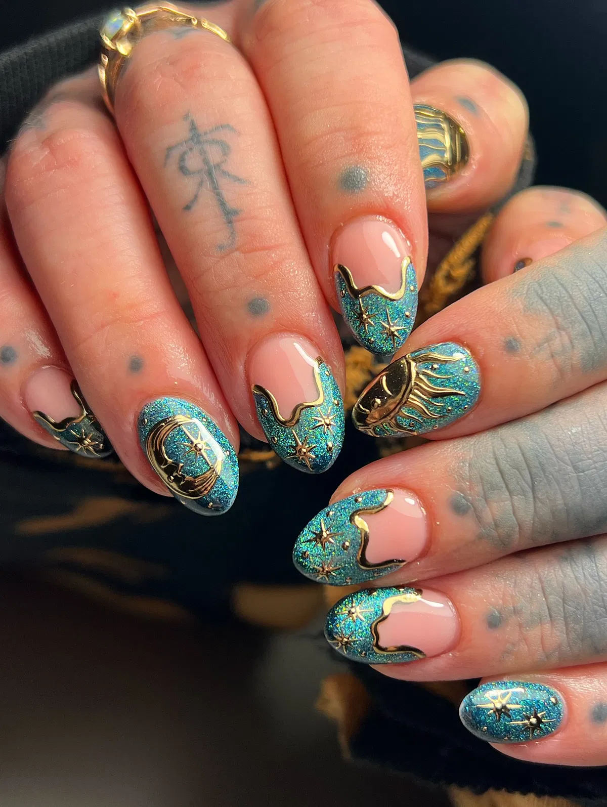 Teal glitter tips with gold celestial details