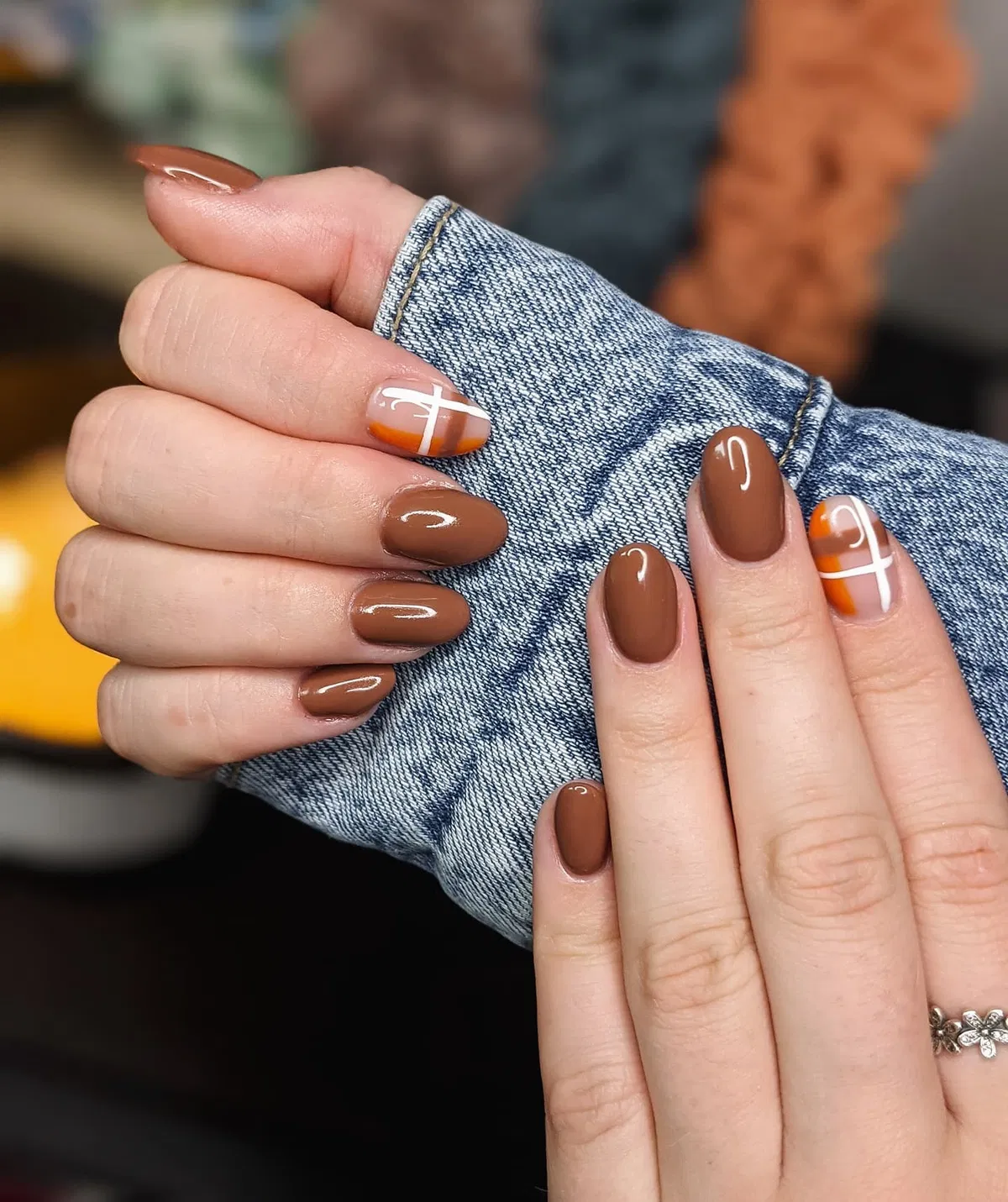 Glossy brown set with nude-and-orange accents and white cross linework