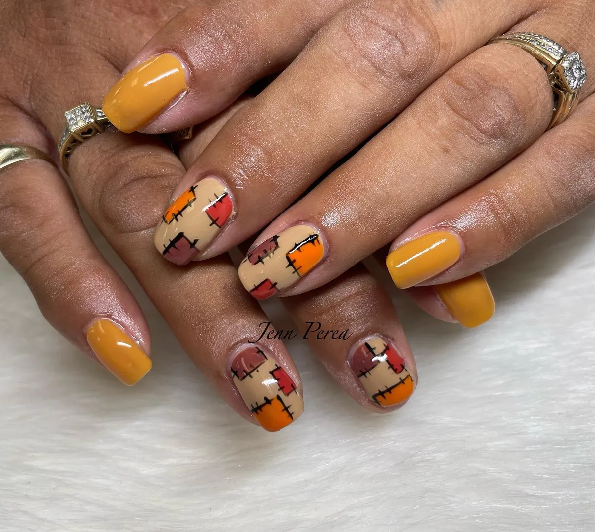 Mustard solids with beige patchwork blocks and black stitch-like outlines