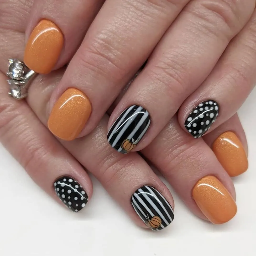 Orange shimmer with stripes, polka dots, and tiny pumpkin accents