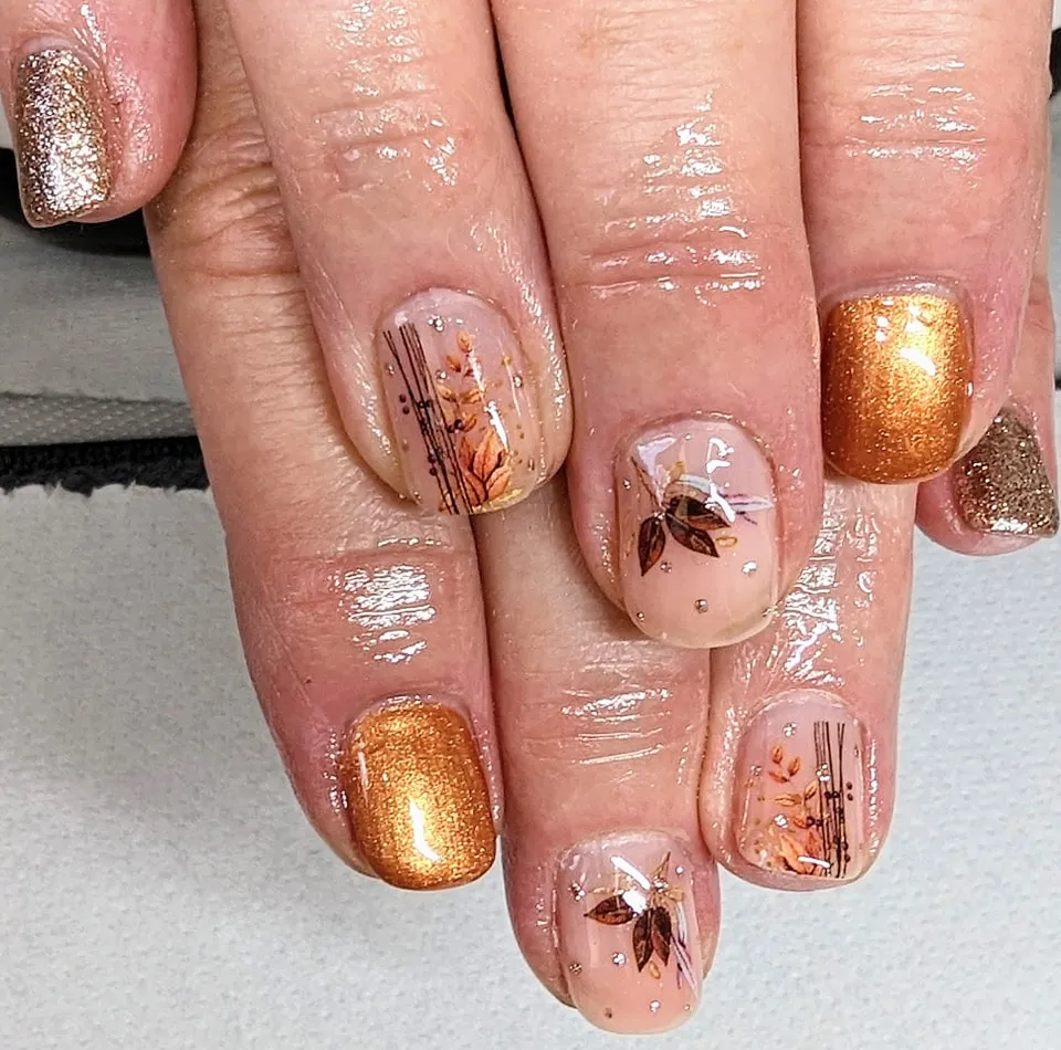 Metallic gold and nude accents with fine-line leaf branches