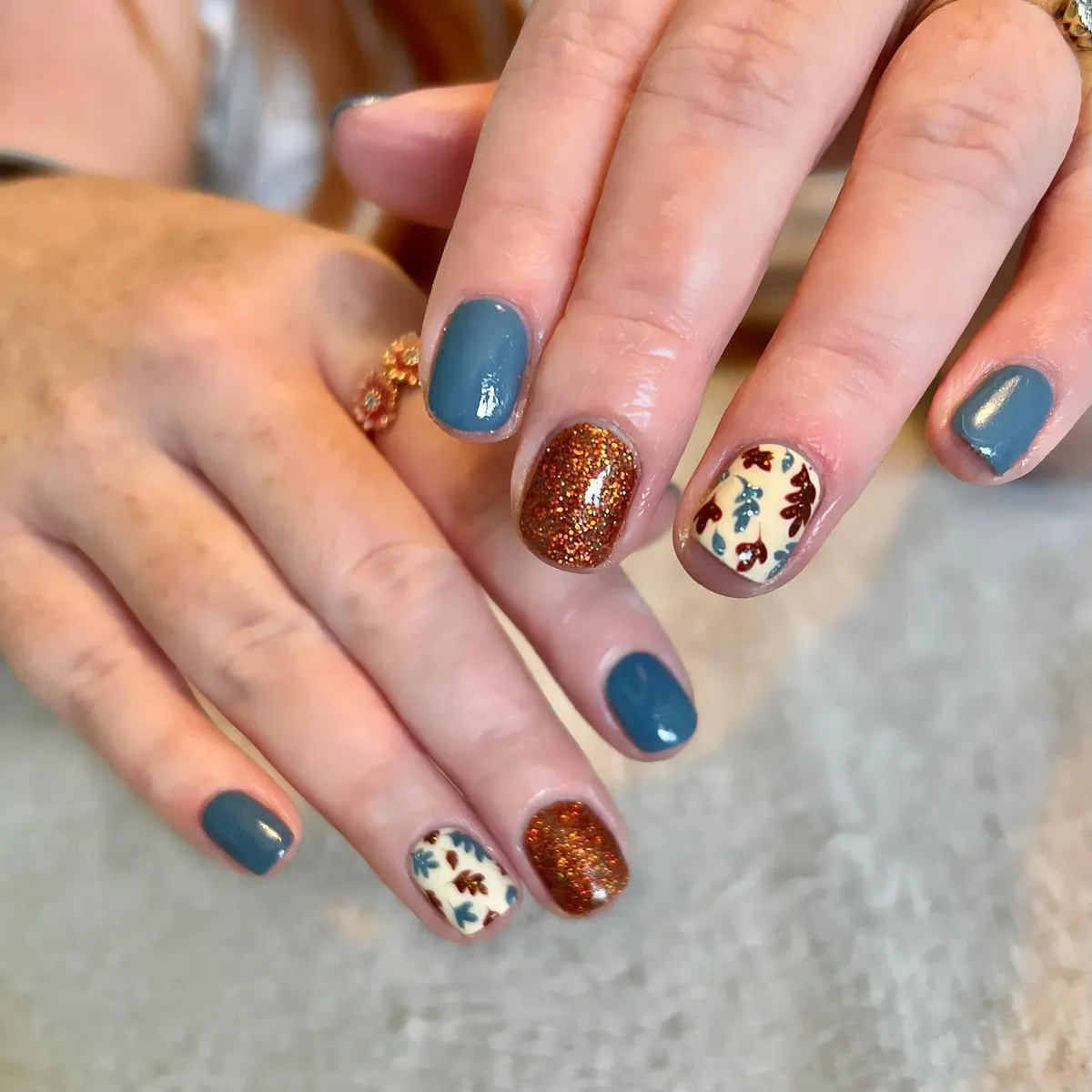 Blue-gray solids with copper glitter and cream leaf accents