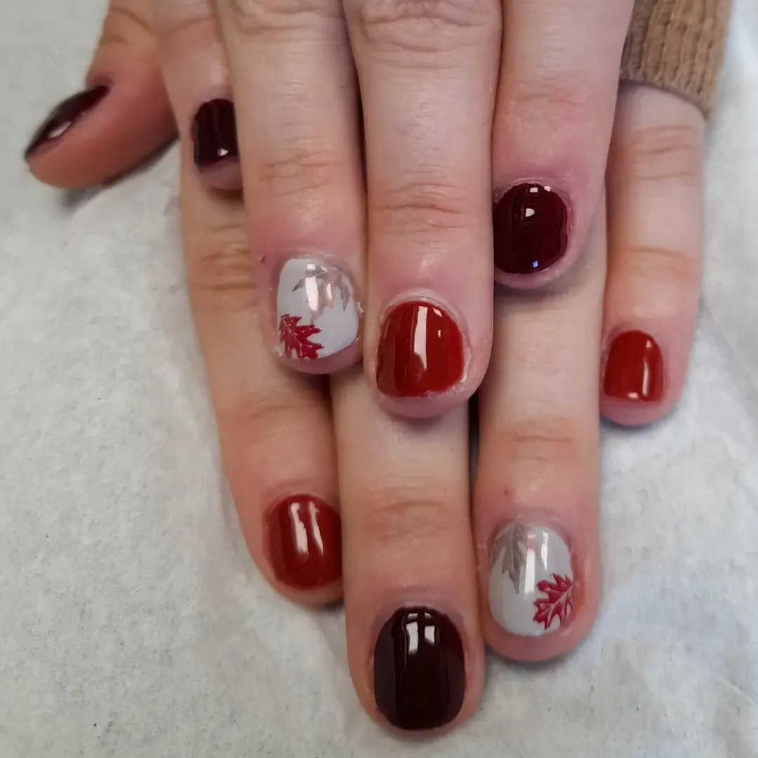 Burgundy and brick red with gray leaf accents