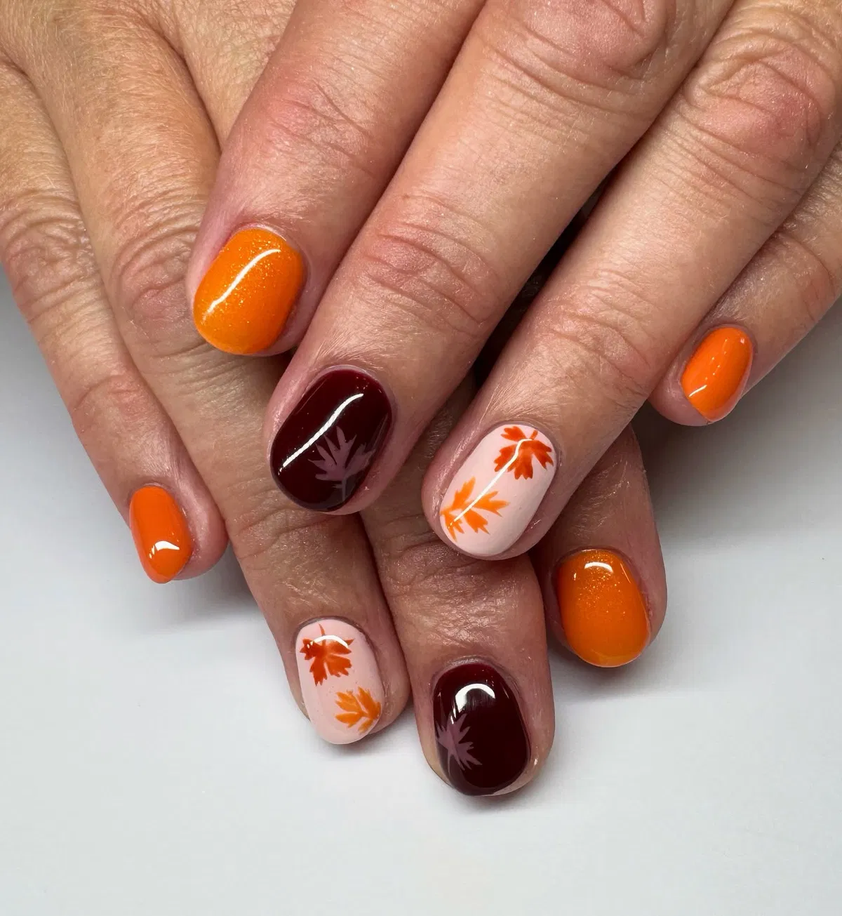 Orange and burgundy set with leaf silhouettes