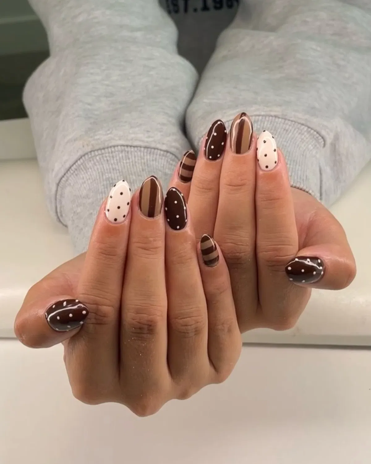 Brown-and-cream mix with stripes and polka dots
