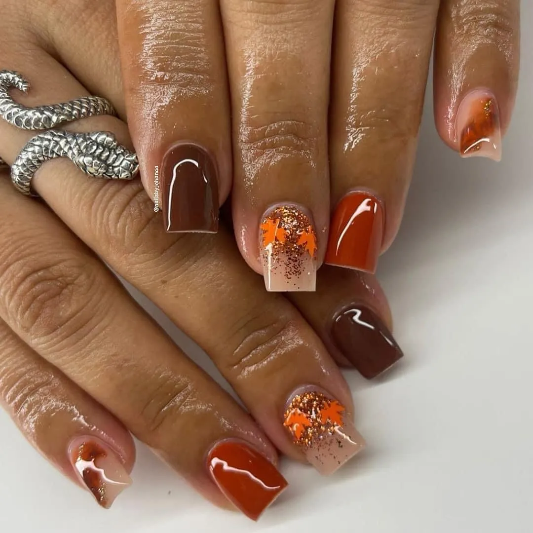 Burnt orange and brown with leaf silhouettes and glitter accents