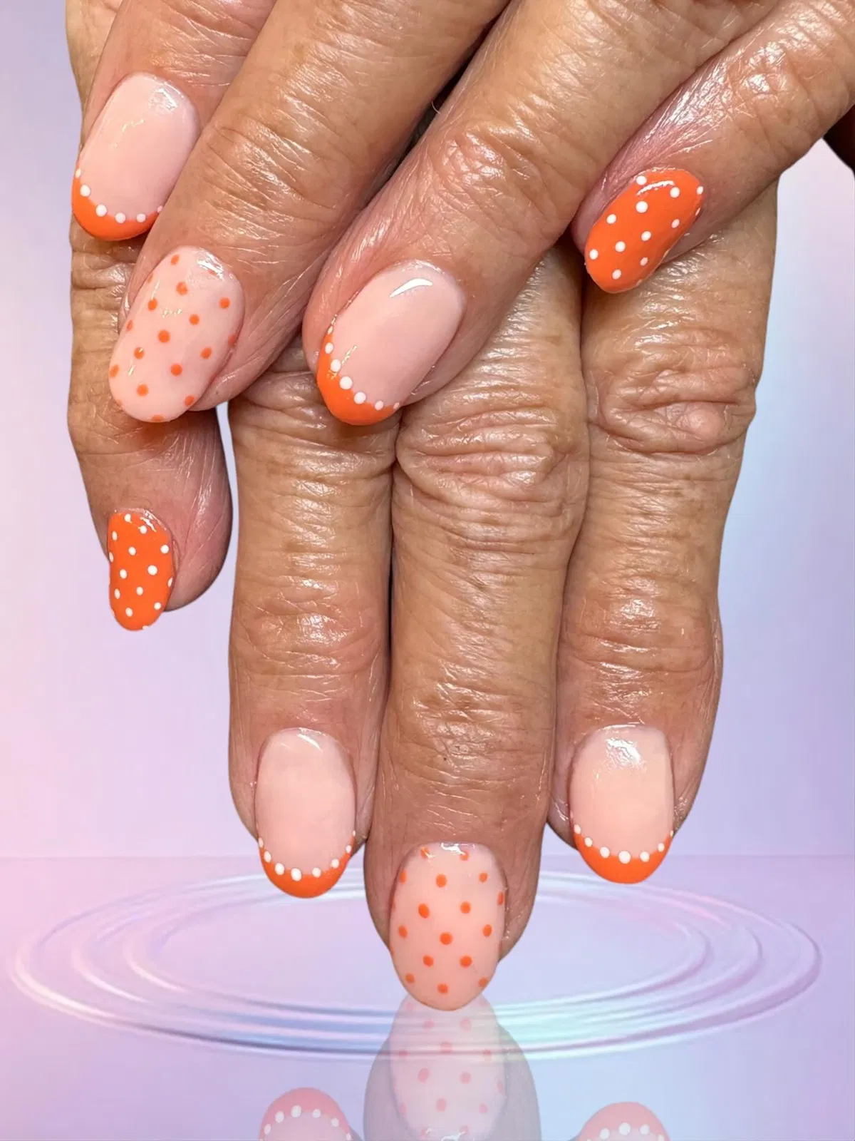Orange French tips with polka dots